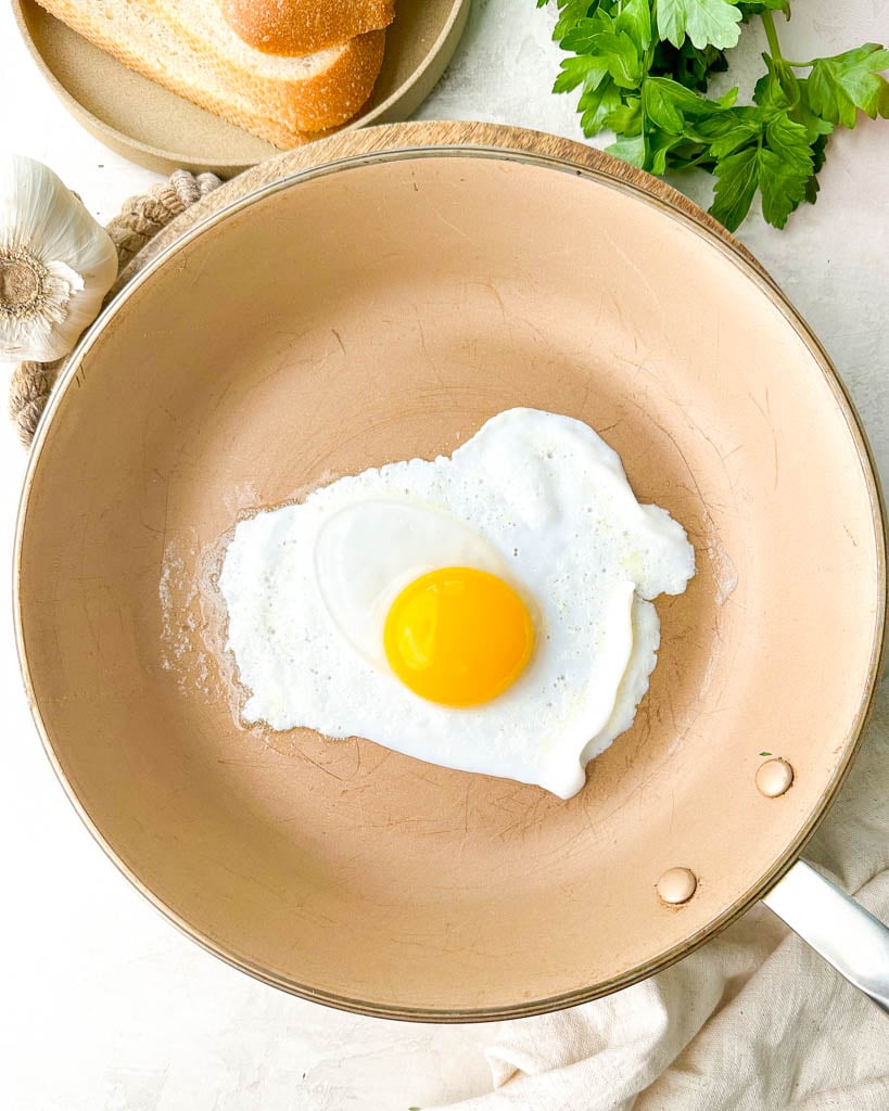 a duck egg frying in a pan