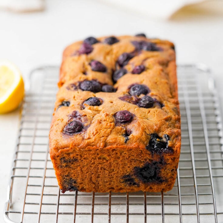 gluten free lemon blueberry bread on a wire rack