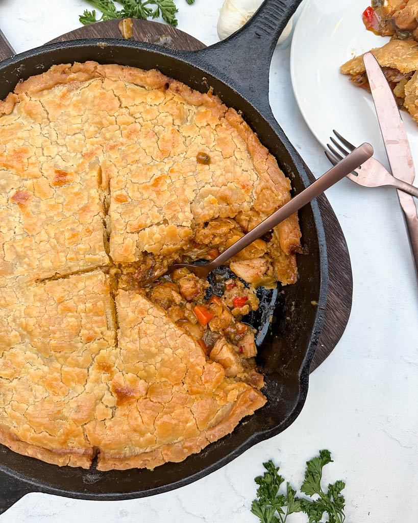 chicken pot pie, with one slice removed to reveal the inside