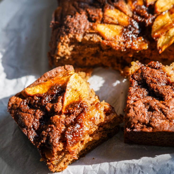 slices of apple cake on parchment paper