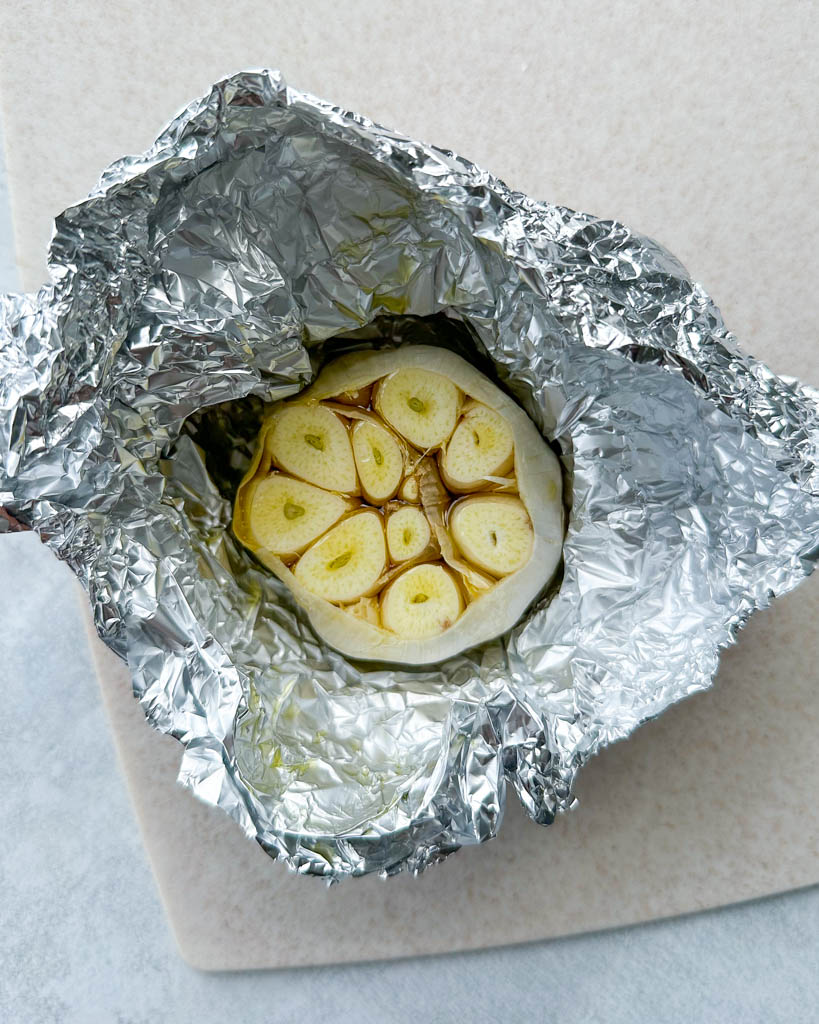 a head of garlic wrapped in foil