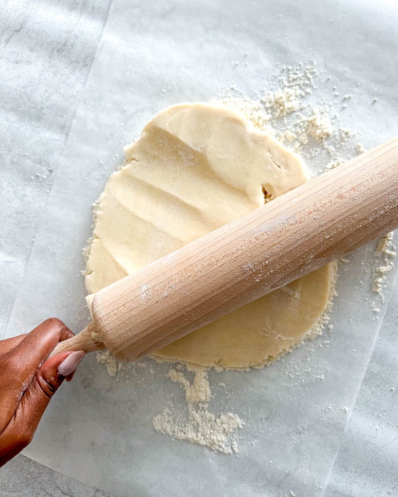 rolling out gluten free galette dough with a rolling pin
