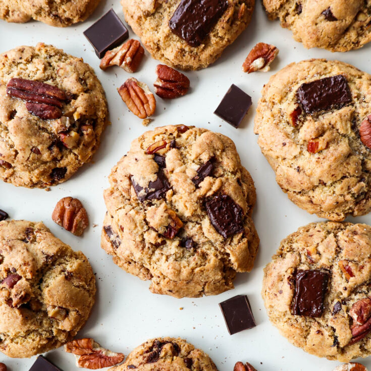 butter pecan chocolate chip cookies with pecans chocolate chips scattered in between