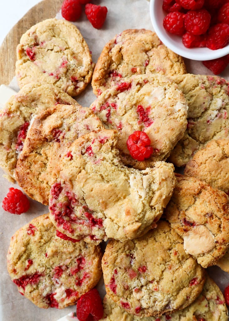 a large plate of white chocolate raspberry cookies