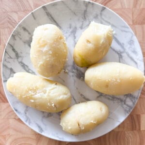 peeled potatoes on a plate