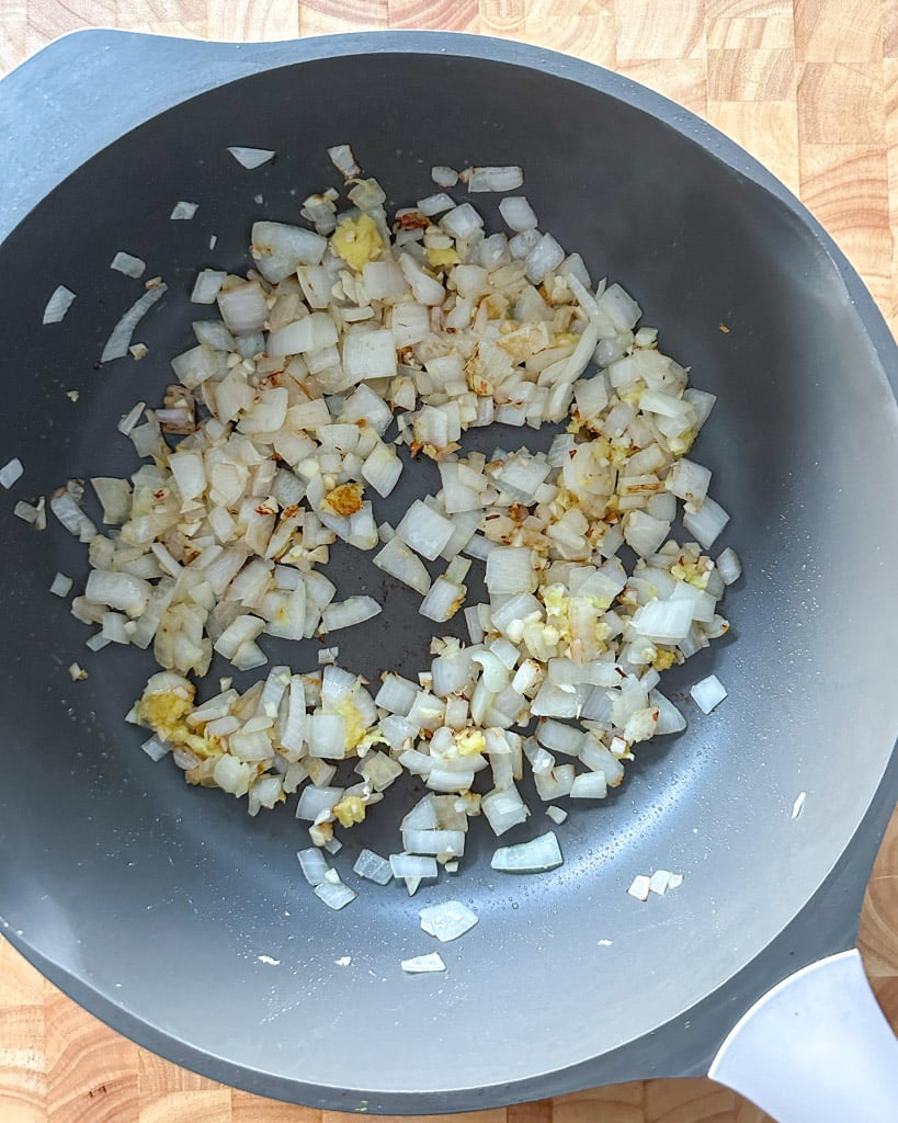 onions garlic and ginger in a large skillet