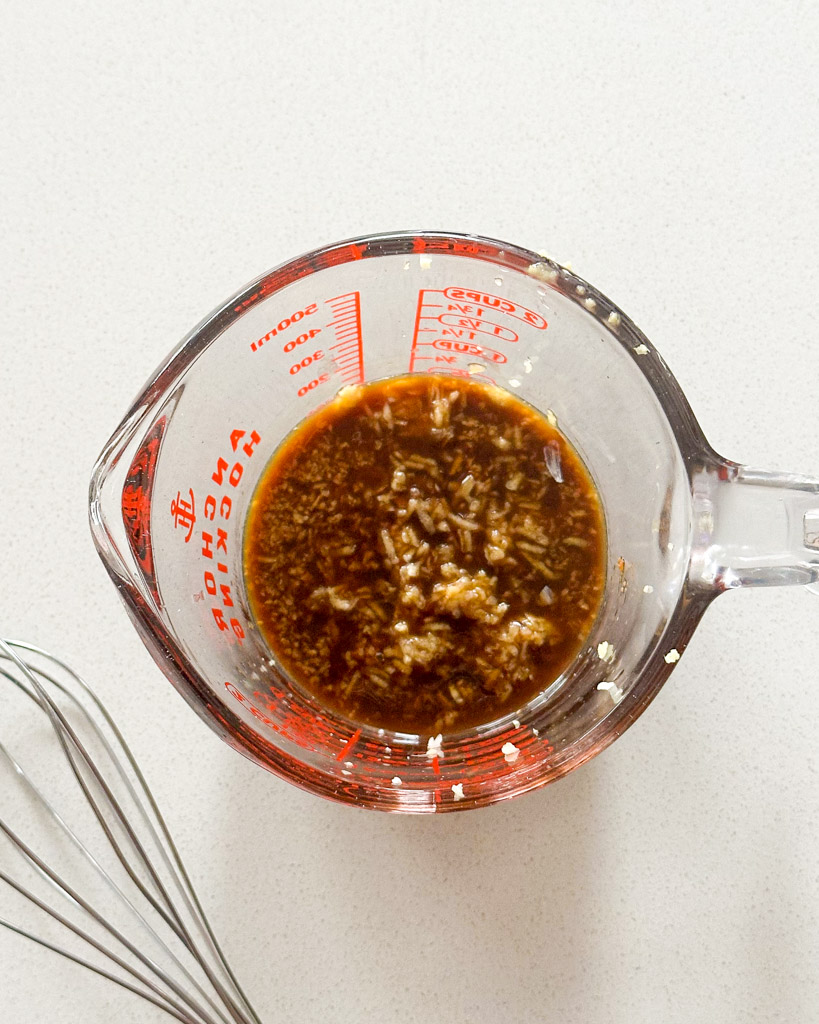 honey ginger sauce in a measuring cup