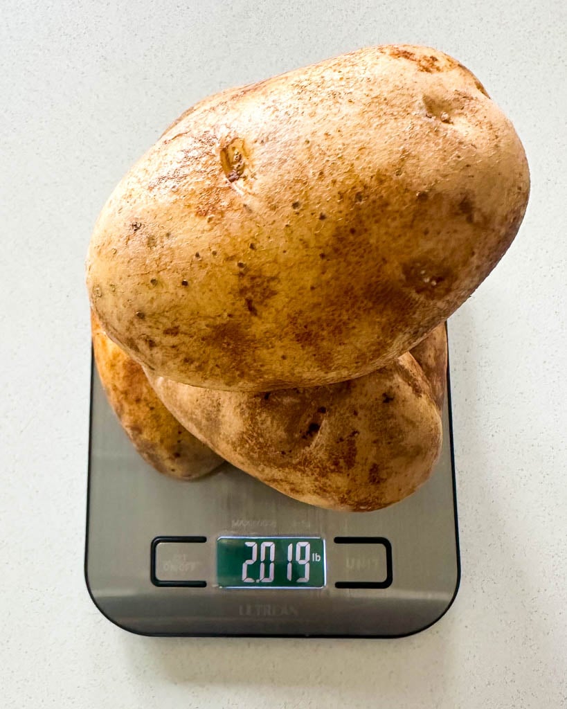 russet potatoes on a scale that reads 2.019 lb