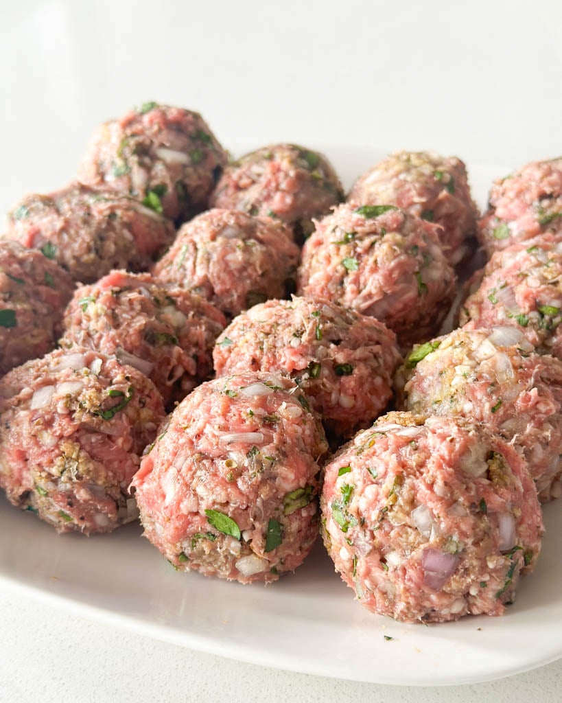 raw lamb meatballs formed and ready to cook