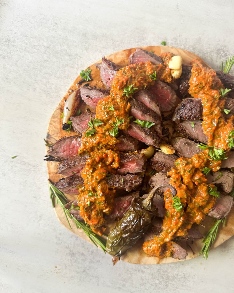 bison steak with red chimichurri sauce