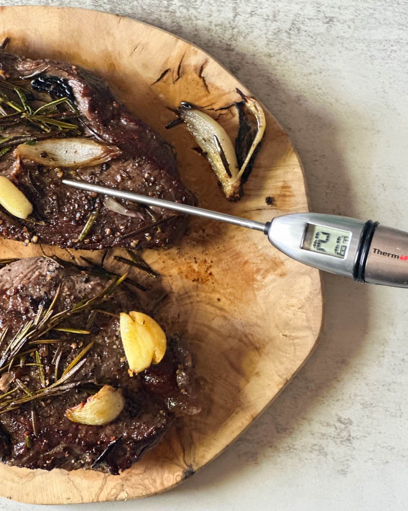 instant thermometer in bison sirloin that reads 121