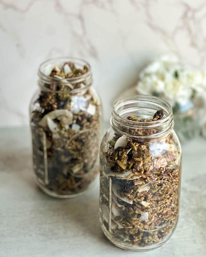 two mason jars filled with grain free nut free seed granola