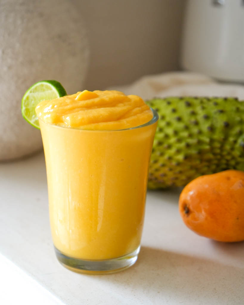 mango soursop smoothie in a glass