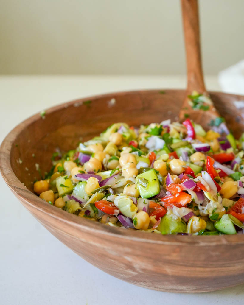 chickpea cucumber salad in a large wooden bowl