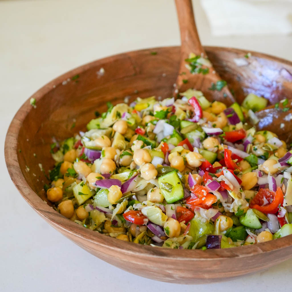 chickpea cucumber salad in a large wooden bowl