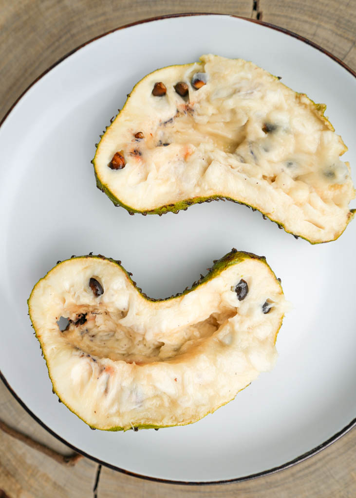 soursop cut in half on a plate