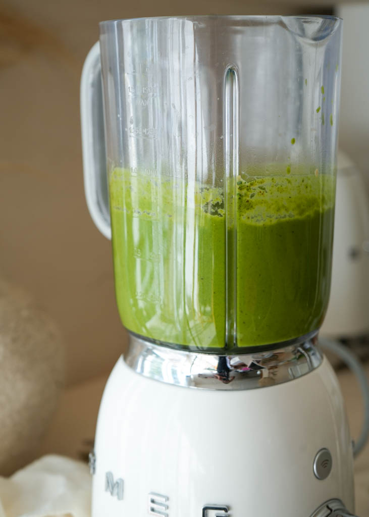 blended green pasta sauce in a blender