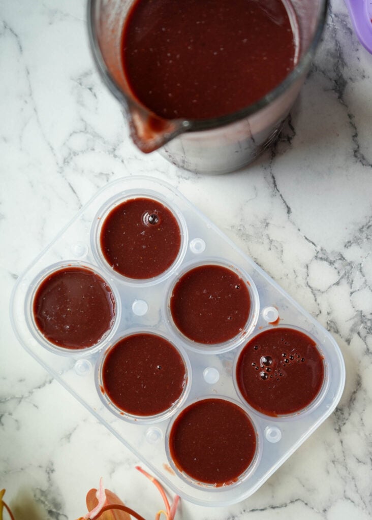 filled ice molds with elderberry tea bombs mixture