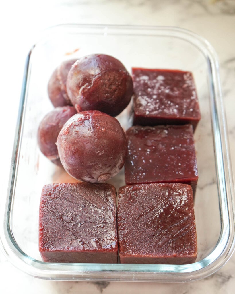 frozen elderberry bombs in a glass container