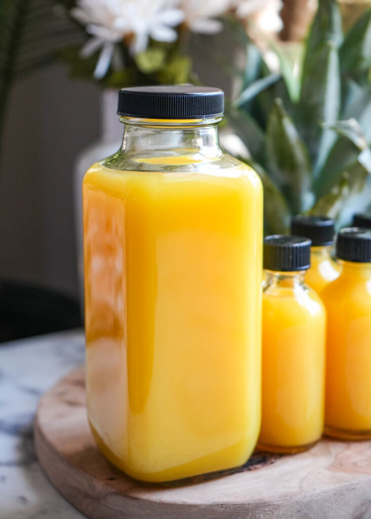 ginger turmeric lemongrass pineapple juice shots and whole bottle juice