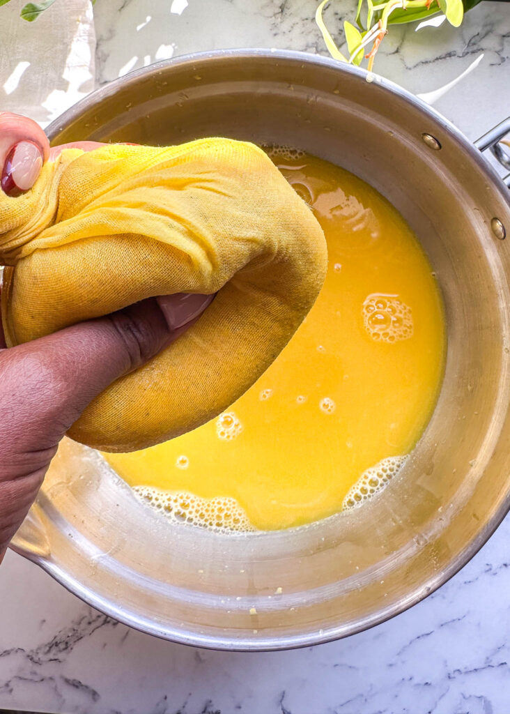 squeezing juice in cheese cloth