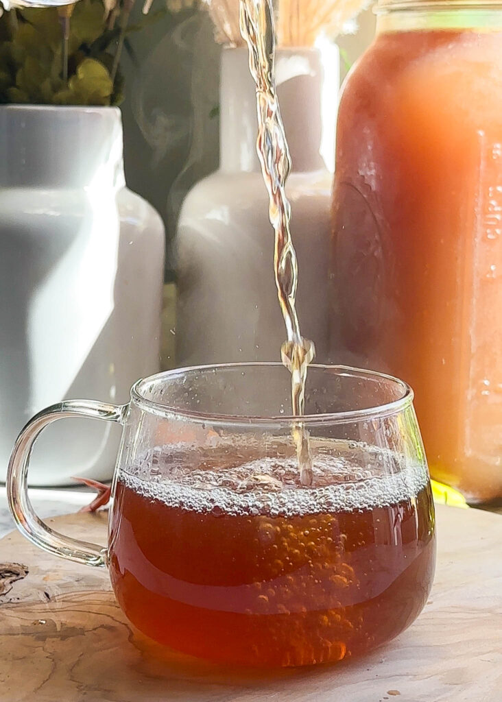 bone broth poured into glass tea mug