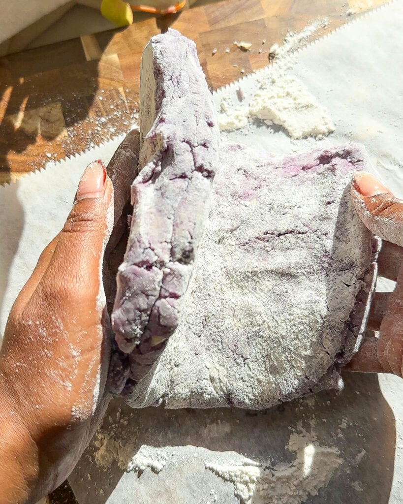 folding sweet potato dough for biscuits