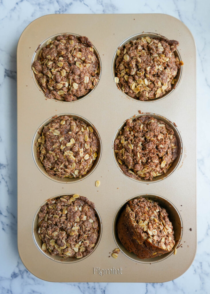 baked pumpkin muffins in a muffin tin