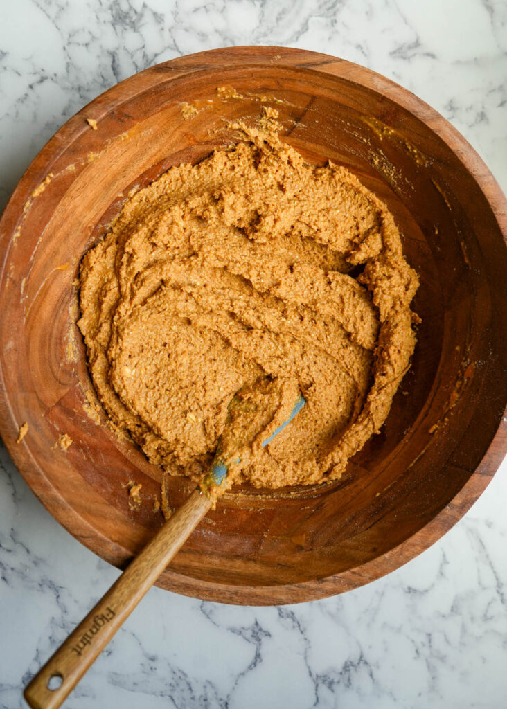 batter for pumpkin protein muffins in a bowl