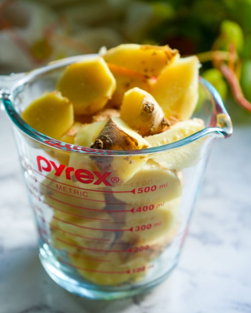 fresh ginger in a measuring cup