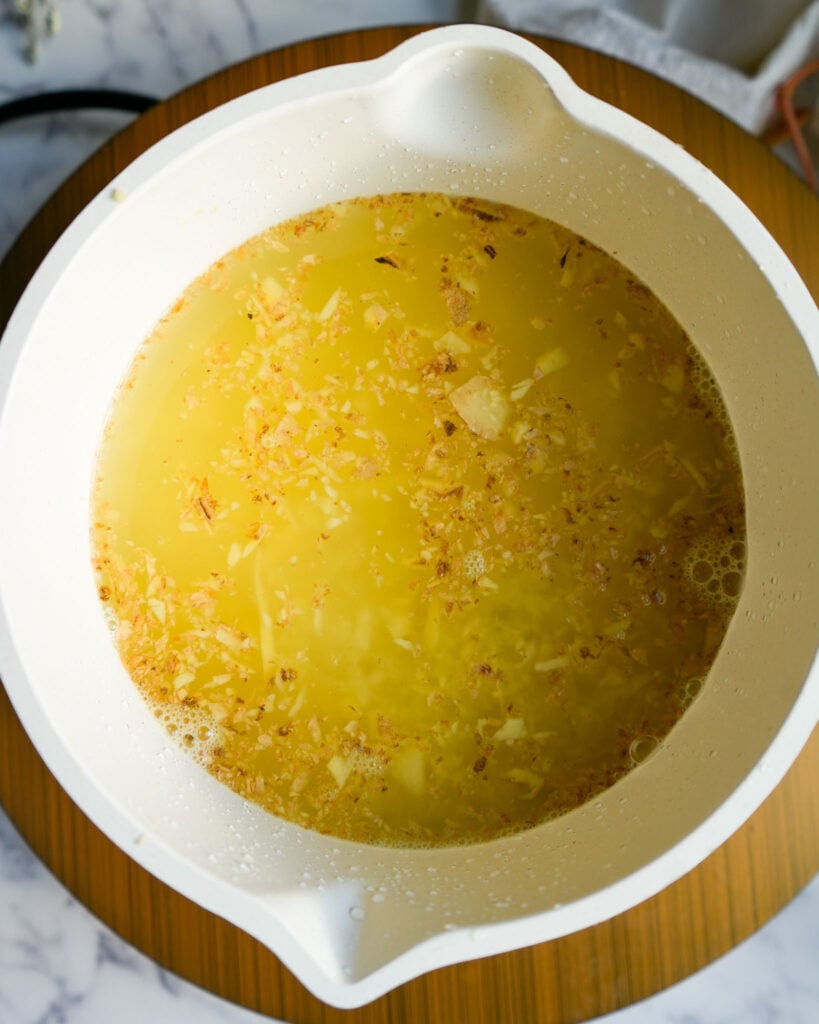 ginger simmering in a pot of water