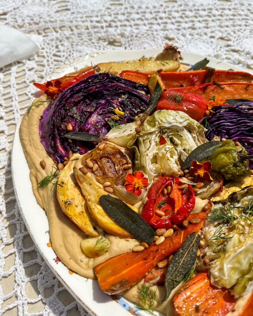 roasted vegetables on a bed of creamy bean puree