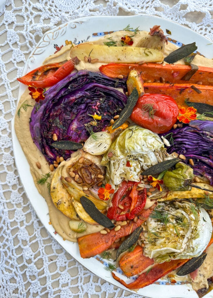 roasted vegetables on a bed of creamy bean puree