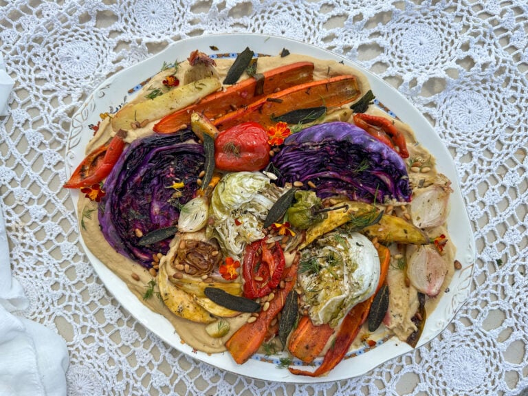 roasted vegetables on a bed of creamy bean puree