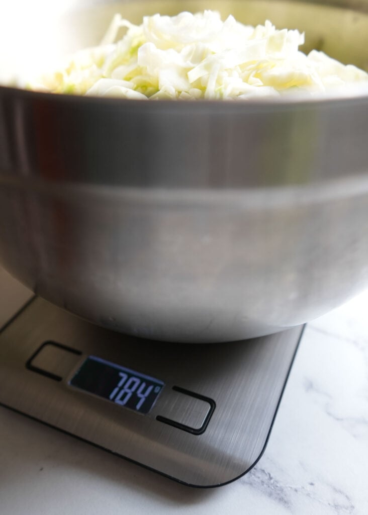 weighing cabbage on scale