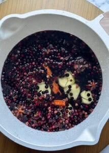 elderberries with ginger cinnamon star anise in a pot