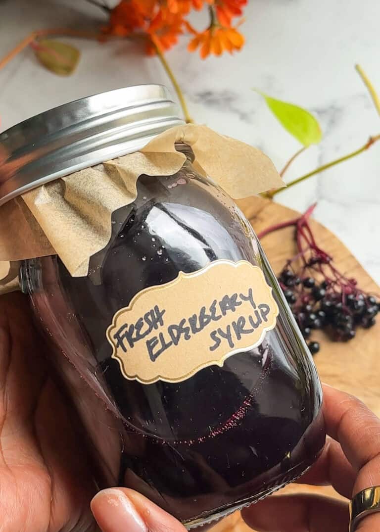fresh elderberry syrup homemade in a mason jar