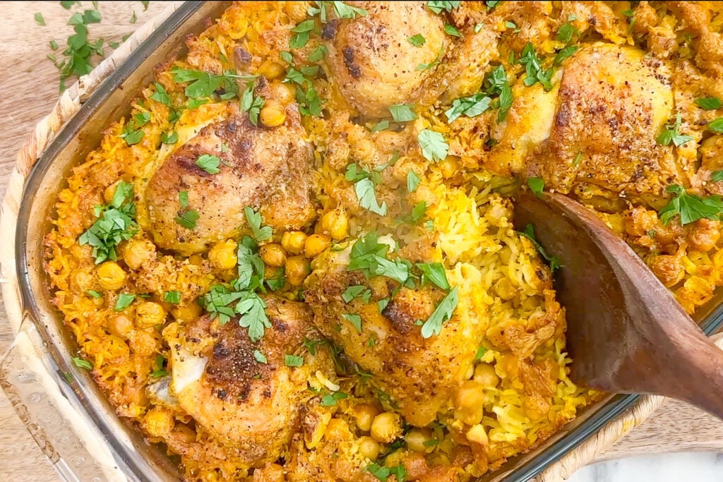 oven baked chicken and rice in a baking dish