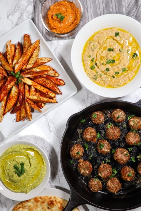Middle Eastern Lamb Kofta Recipe lamb meatballs with eggplant dip almond red pepper dip and cilantro jalapeno hummus
