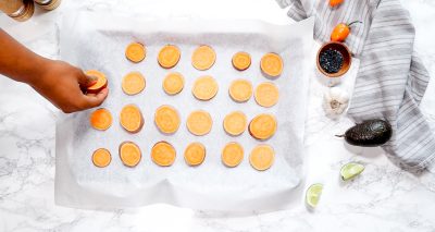 how to make sweet potato chips. placing sliced nachos on a baking tray