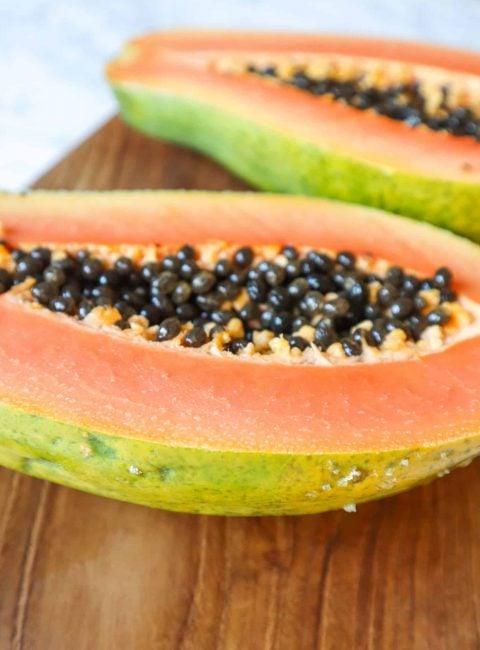 papaya cut in half to prepare